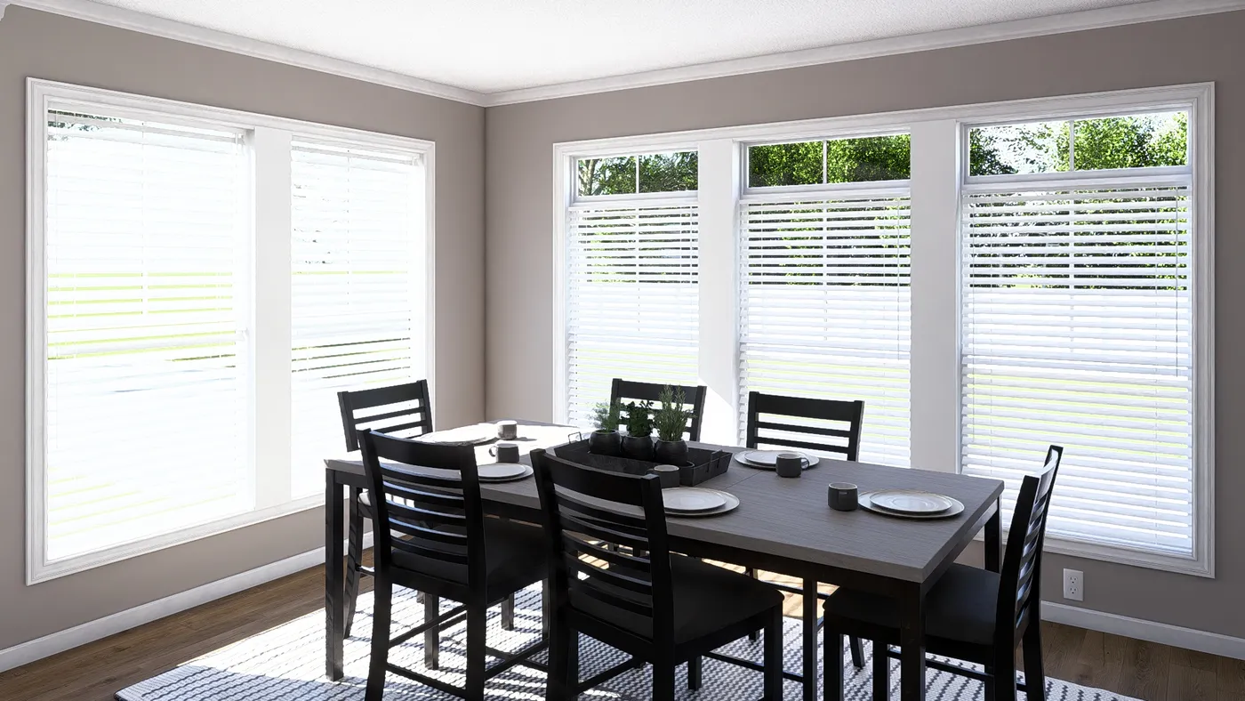 The THE ABIGAIL II Dining Room. This Manufactured Mobile Home features 3 bedrooms and 2 baths.