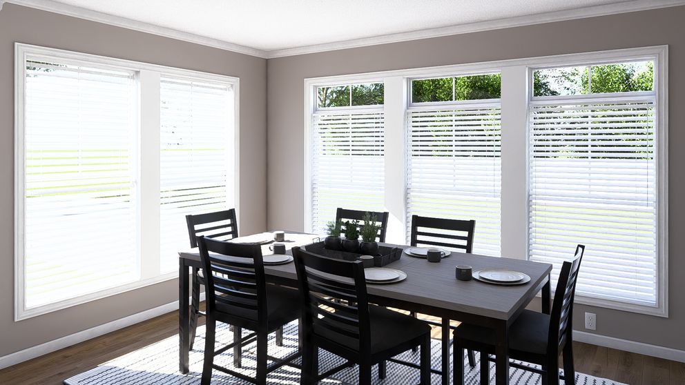 The THE ABIGAIL II Dining Room. This Manufactured Mobile Home features 3 bedrooms and 2 baths.