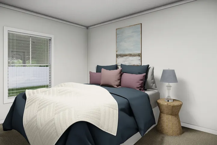 The THE PARKER Bedroom. This Manufactured Mobile Home features 3 bedrooms and 2 baths.