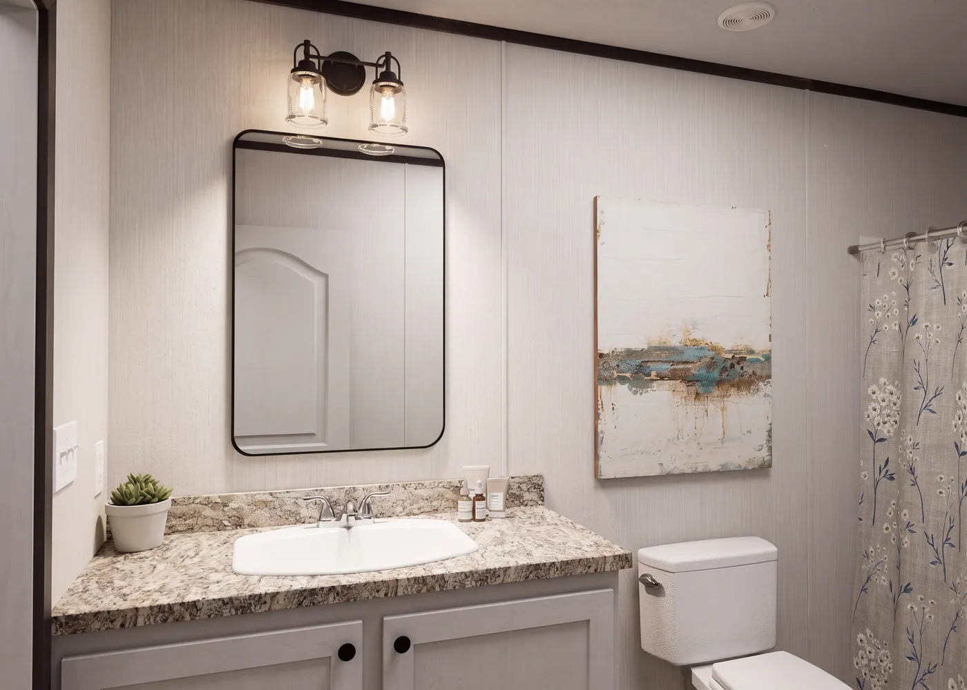 The THE FUSION 32H Guest Bathroom. This Manufactured Mobile Home features 5 bedrooms and 3 baths.