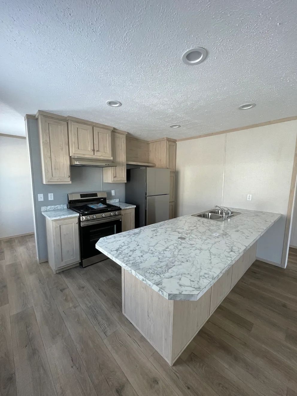 The JADE 48 Kitchen. This Manufactured Mobile Home features 3 bedrooms and 2 baths.