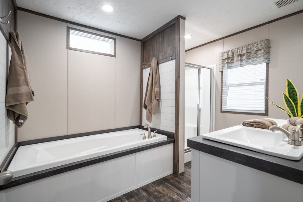 The THE GENERAL Primary Bathroom. This Manufactured Mobile Home features 3 bedrooms and 2 baths.