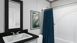 The 7616-4700 THE PULSE Guest Bathroom. This Manufactured Mobile Home features 3 bedrooms and 2 baths.