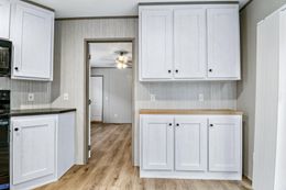 The ANNIVERSARY 16763F Kitchen. This Manufactured Mobile Home features 3 bedrooms and 2 baths.