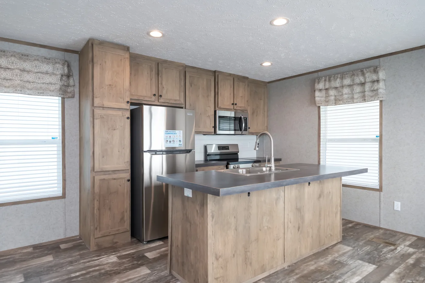 The LAKESIDE COTTAGE Kitchen. This Manufactured Mobile Home features 1 bedroom and 1 bath.