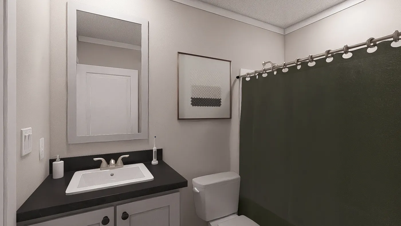 The UNDER PRESSURE Guest Bathroom. This Manufactured Mobile Home features 3 bedrooms and 2 baths.