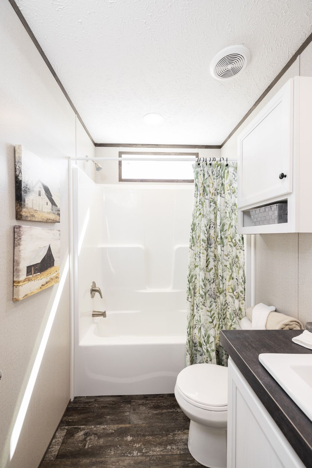 THE SURE THING Guest Bathroom. This Home features 3 bedrooms and 2 baths.