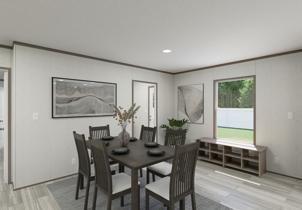 The THE MOUNTAINEER 64 Dining Room. This Manufactured Mobile Home features 3 bedrooms and 2 baths.
