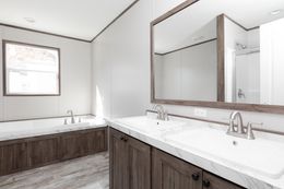 The LEWIS Primary Bathroom. This Manufactured Mobile Home features 3 bedrooms and 2 baths.
