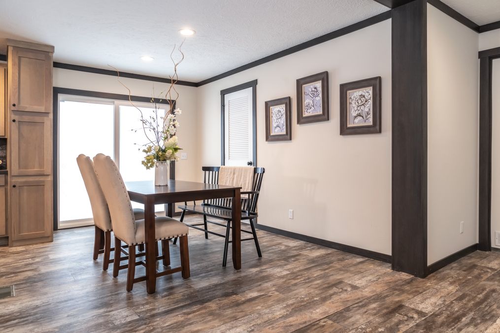 The BOUJEE 2 Dining Area. This Manufactured Mobile Home features 3 bedrooms and 2 baths.
