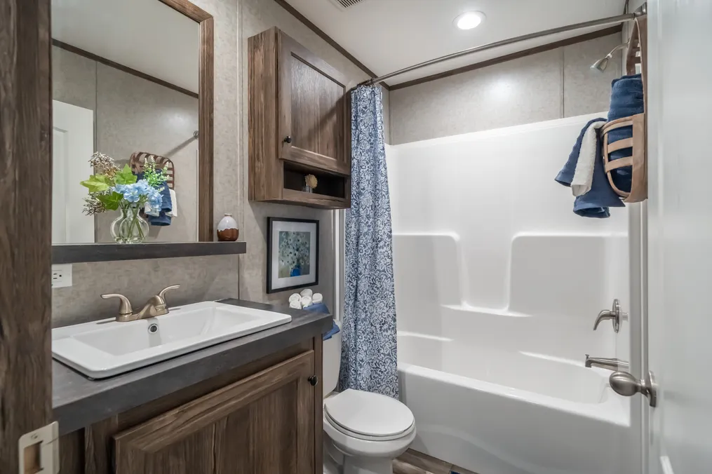 The LIBERTY Guest Bathroom. This Manufactured Mobile Home features 3 bedrooms and 2 baths.