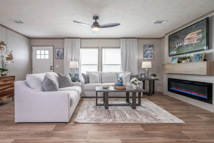 The EL SUENO BREEZE Living Room. This Manufactured Mobile Home features 4 bedrooms and 2 baths.