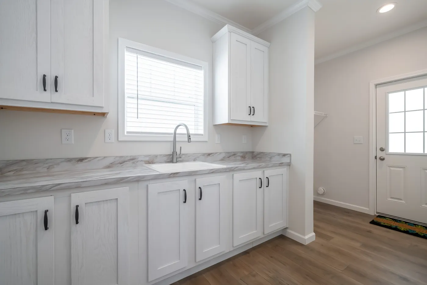 The 1533 THE BROOK HUD Utility Room. This Manufactured Mobile Home features 3 bedrooms and 2 baths.