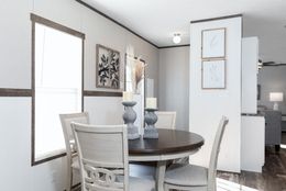 The THE SHOWER HOUSE 2.0 Dining Area. This Manufactured Mobile Home features 3 bedrooms and 2 baths.
