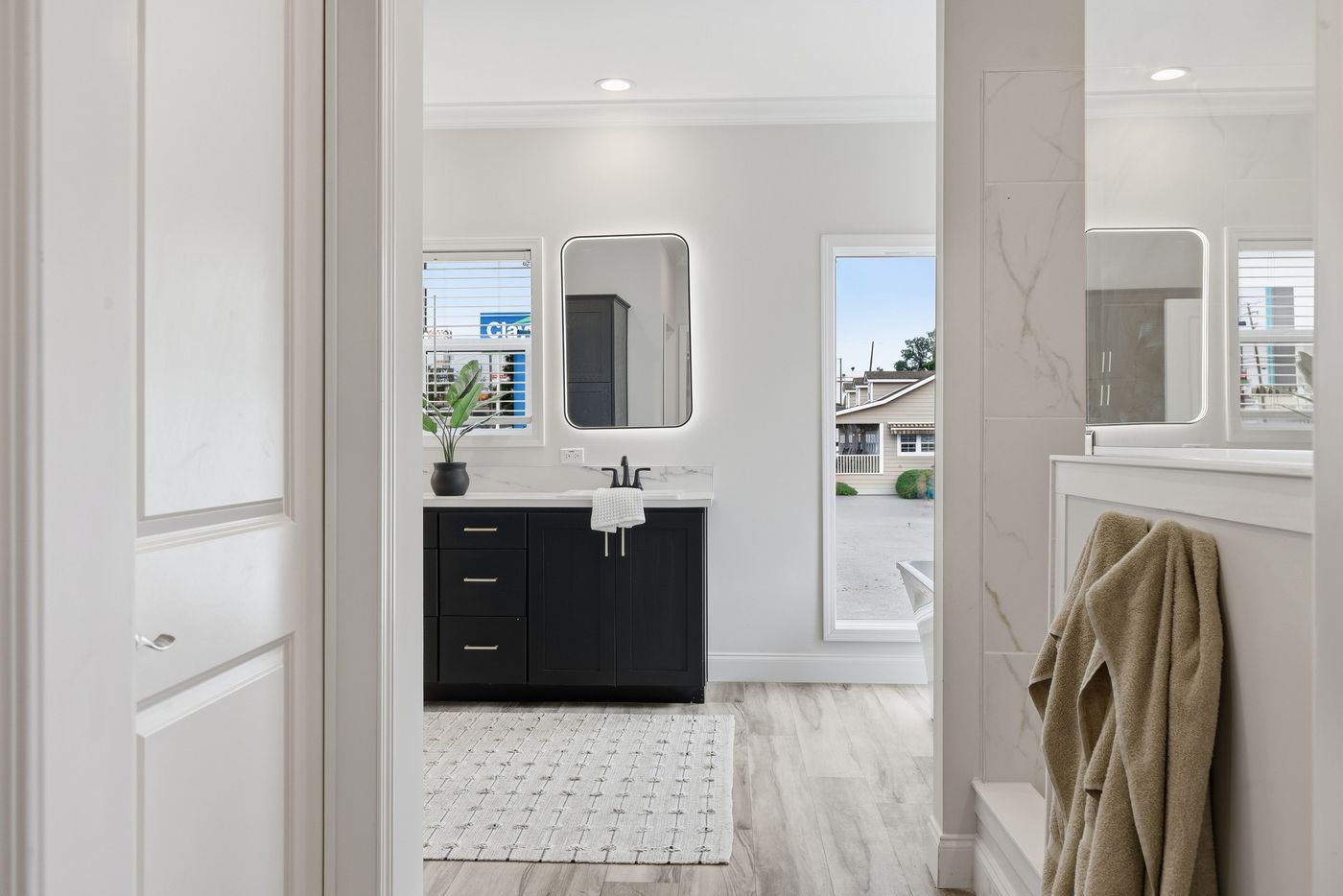 The THE SUMMIT Primary Bedroom. This Manufactured Mobile Home features 3 bedrooms and 2 baths.