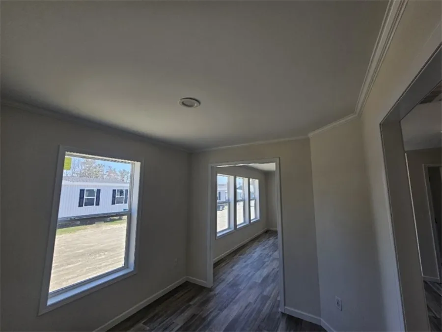 The SPINEL 64 Living Room. This Manufactured Mobile Home features 3 bedrooms and 2 baths.