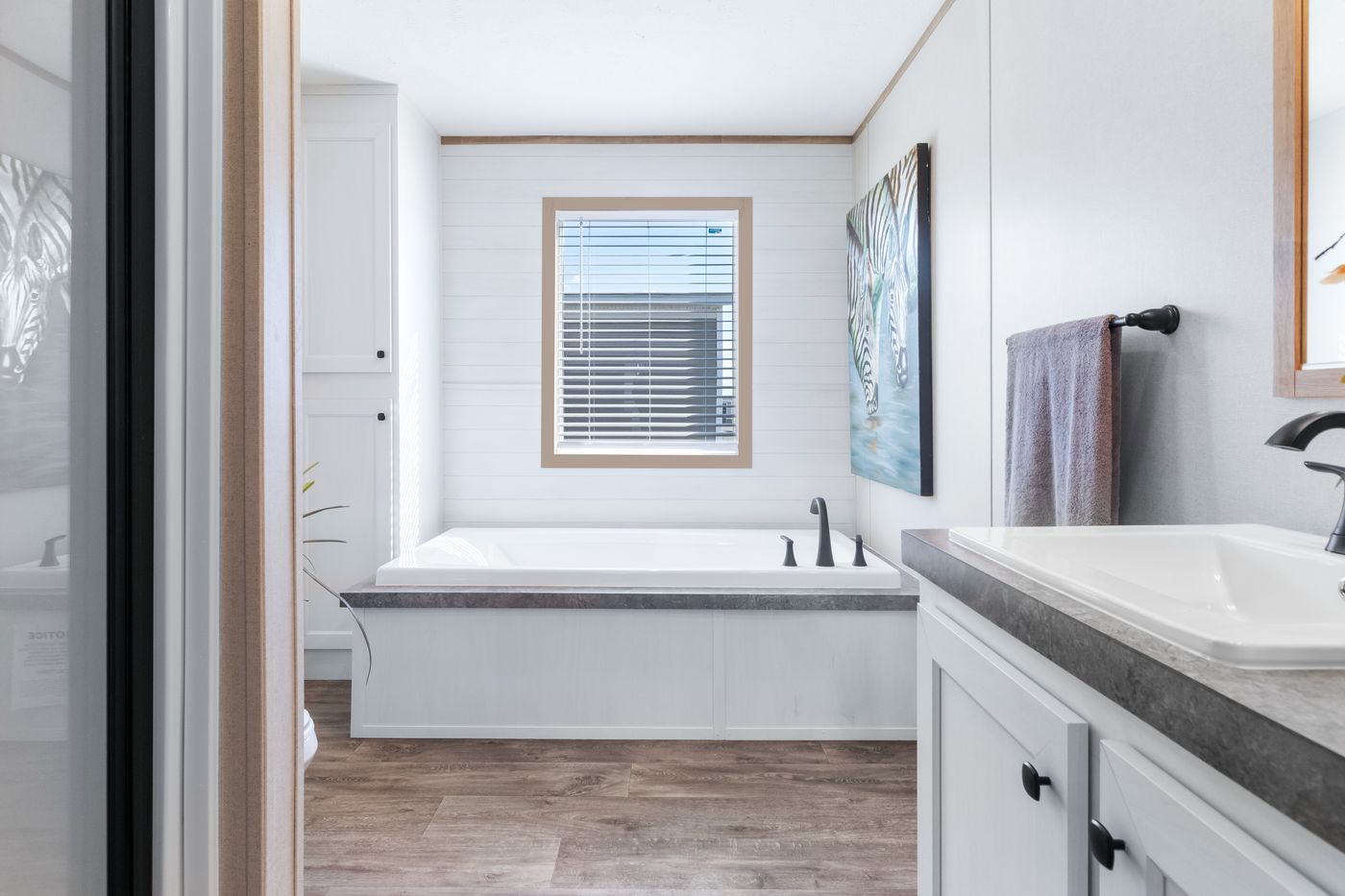 The PT 78 Primary Bathroom. This Manufactured Mobile Home features 3 bedrooms and 2 baths.