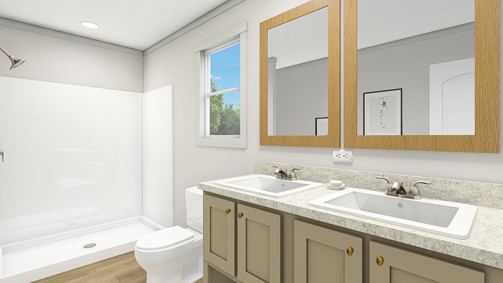 The UNDER PRESSURE Primary Bathroom. This Manufactured Mobile Home features 3 bedrooms and 2 baths.