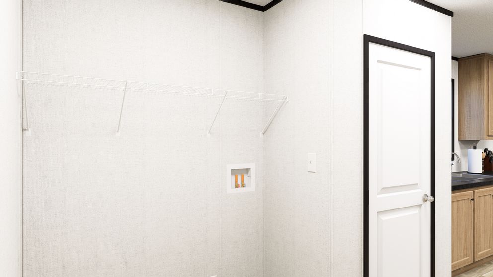 The SOLACE Utility Room. This Manufactured Mobile Home features 4 bedrooms and 2 baths.
