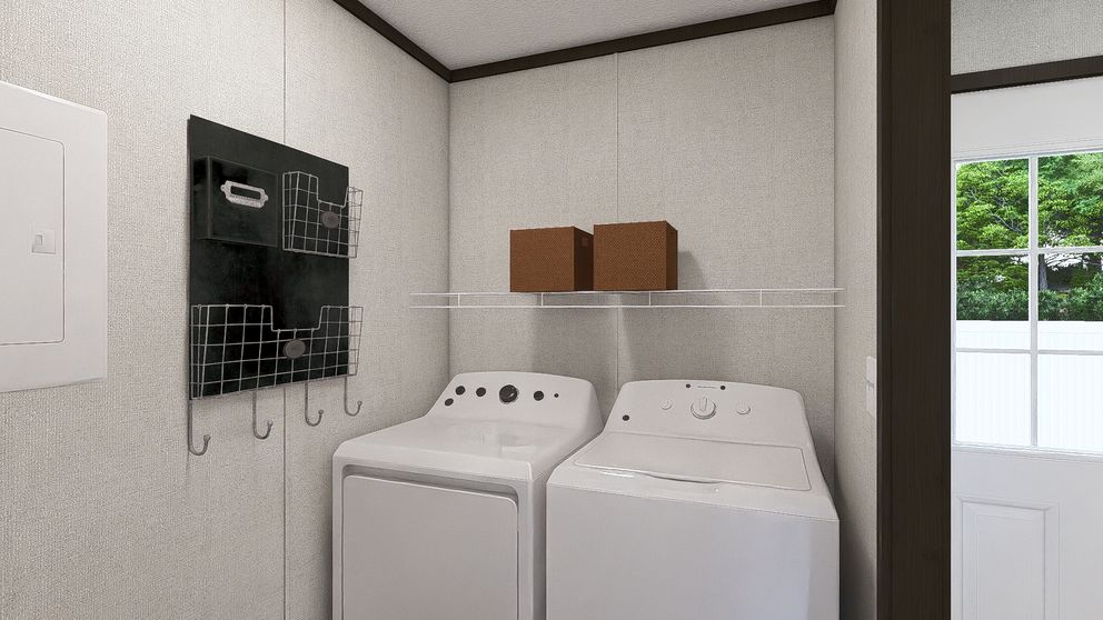 The COLOSSAL Utility Room. This Manufactured Mobile Home features 3 bedrooms and 2 baths.