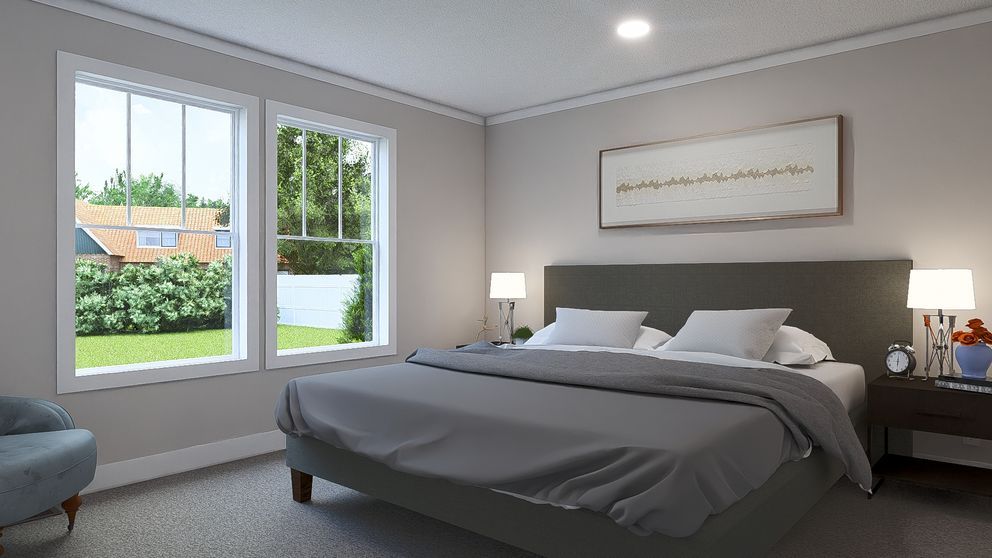 The ROCKET MAN Primary Bedroom. This Manufactured Mobile Home features 3 bedrooms and 2 baths.