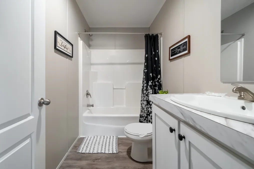 The THE FUSION 68 Guest Bathroom. This Manufactured Mobile Home features 3 bedrooms and 2 baths.