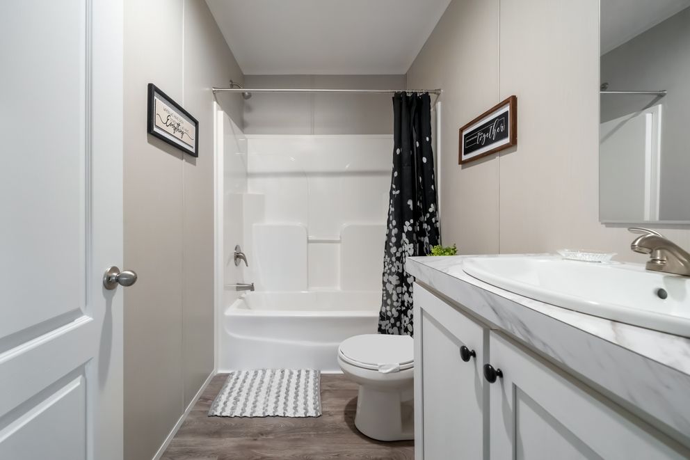 The THE FUSION 68 Guest Bathroom. This Manufactured Mobile Home features 3 bedrooms and 2 baths.