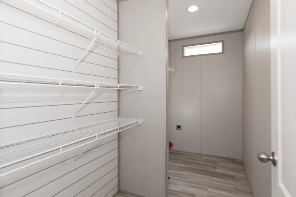 The THE ANNIVERSARY ISLANDER Utility Room. This Manufactured Mobile Home features 3 bedrooms and 2 baths.