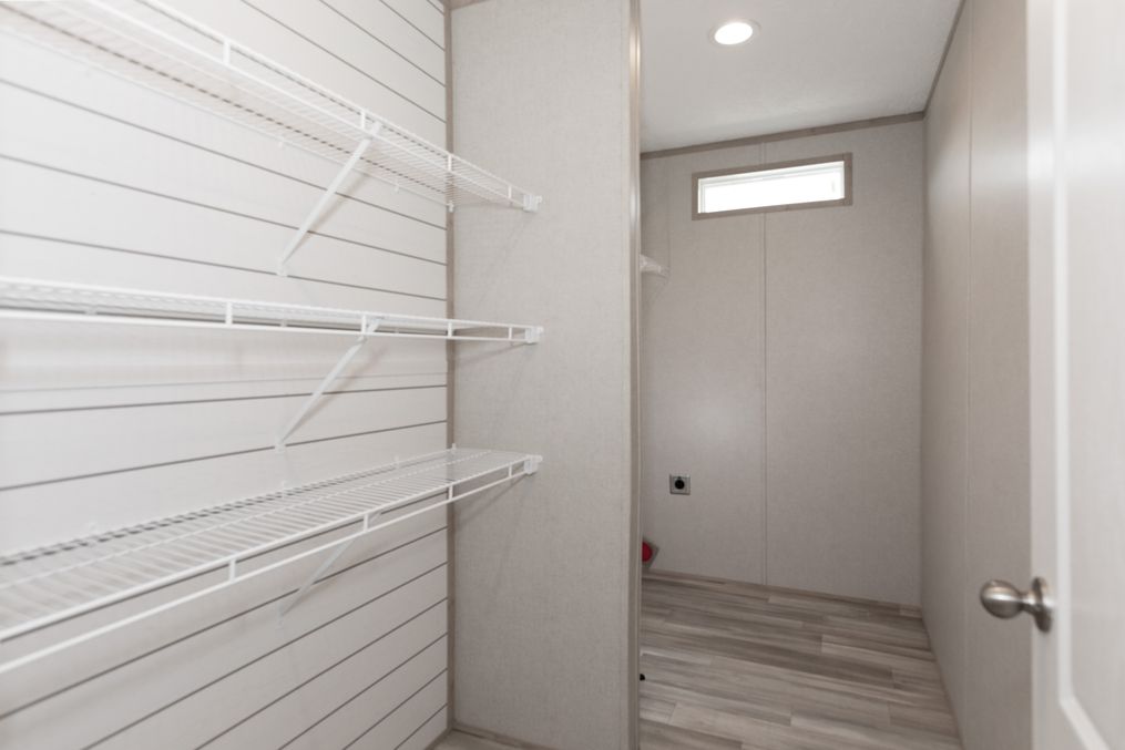 The THE ANNIVERSARY ISLANDER Utility Room. This Manufactured Mobile Home features 3 bedrooms and 2 baths.