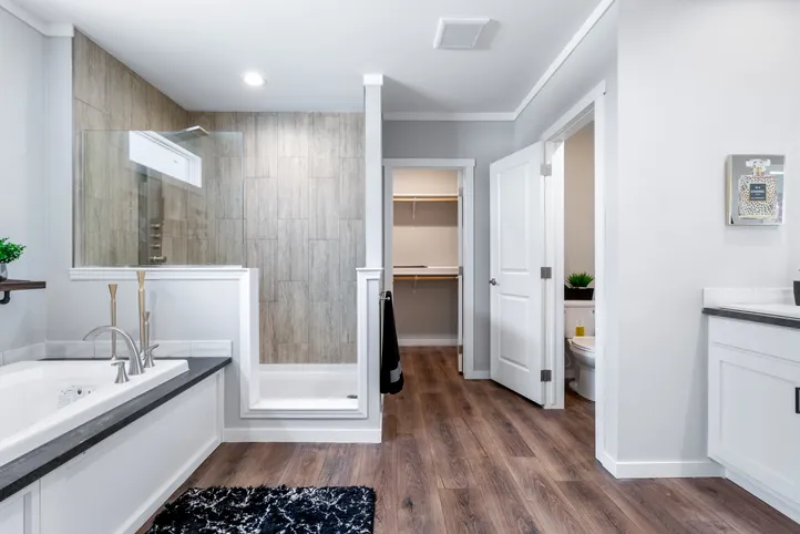 The THE CHANEL Primary Bathroom. This Manufactured Mobile Home features 4 bedrooms and 3 baths.