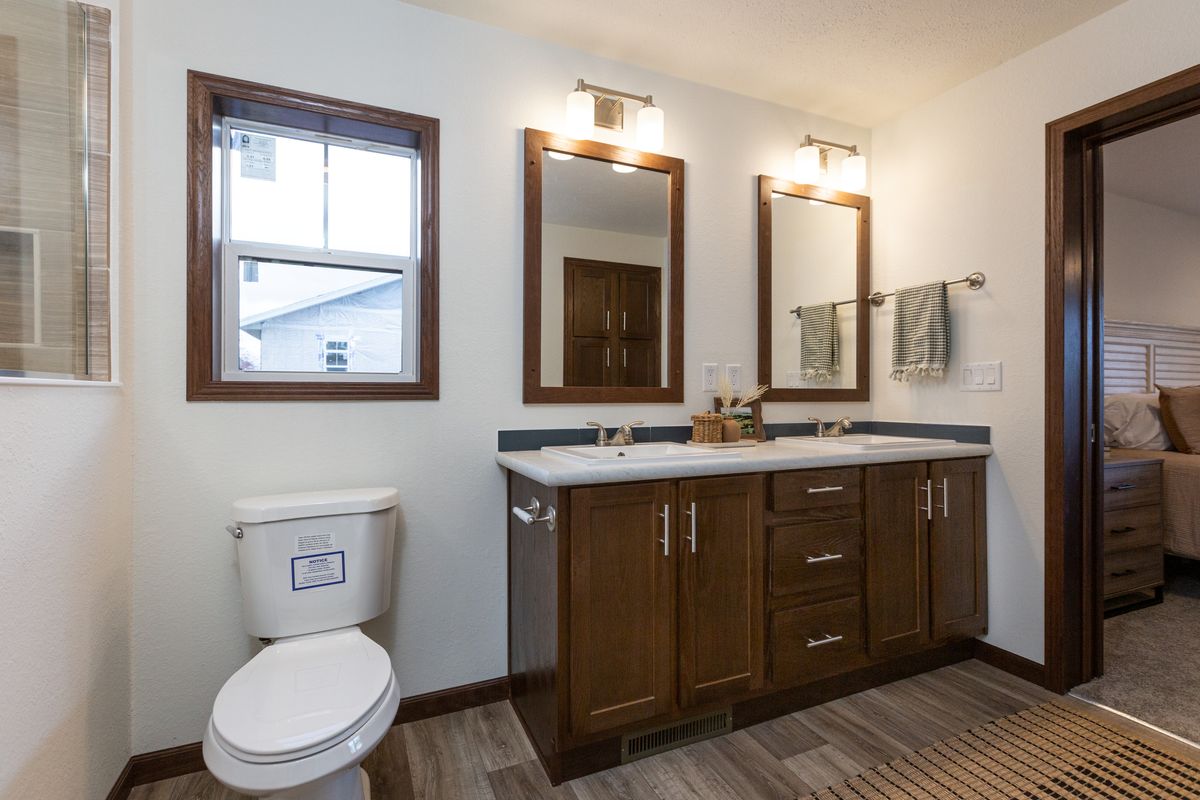 The LEGEND 86 Primary Bathroom. This Manufactured Mobile Home features 3 bedrooms and 2 baths.