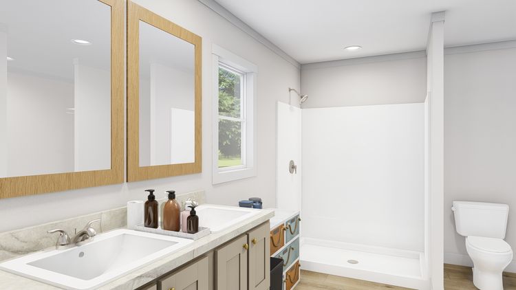 The LET IT BE Primary Bathroom. This Manufactured Mobile Home features 3 bedrooms and 2 baths.