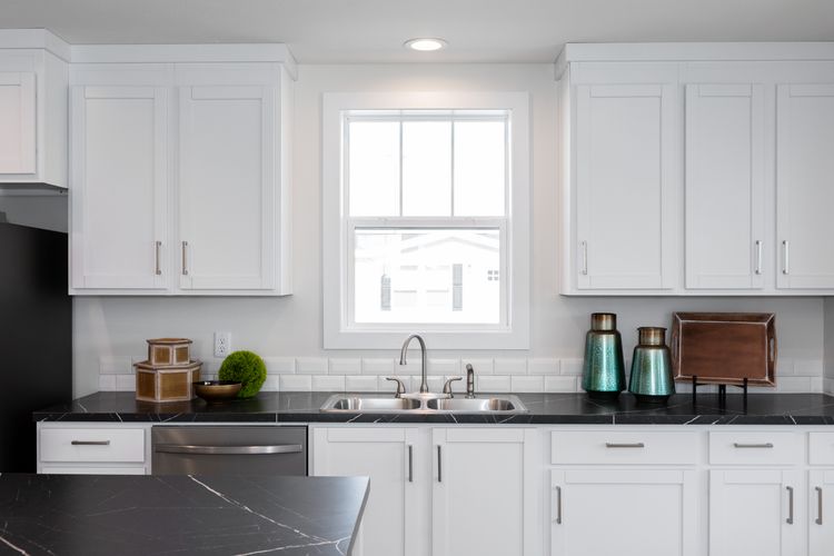 The ECLIPSE/6028-MS063 Kitchen. This Manufactured Mobile Home features 3 bedrooms and 2 baths.
