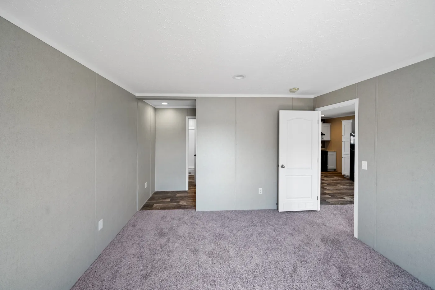 The ZIRCON Primary Bedroom. This Manufactured Mobile Home features 3 bedrooms and 2 baths.