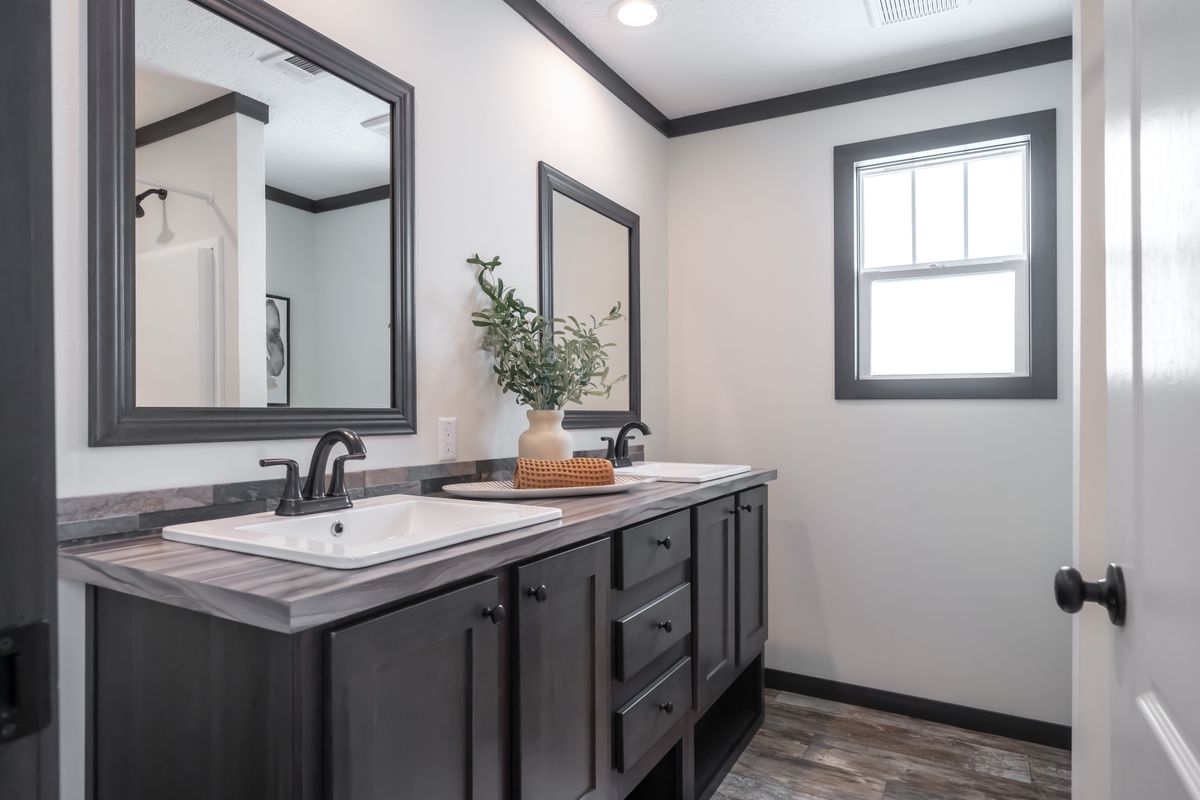 The BOUJEE 56 Guest Bathroom. This Manufactured Mobile Home features 3 bedrooms and 2 baths.