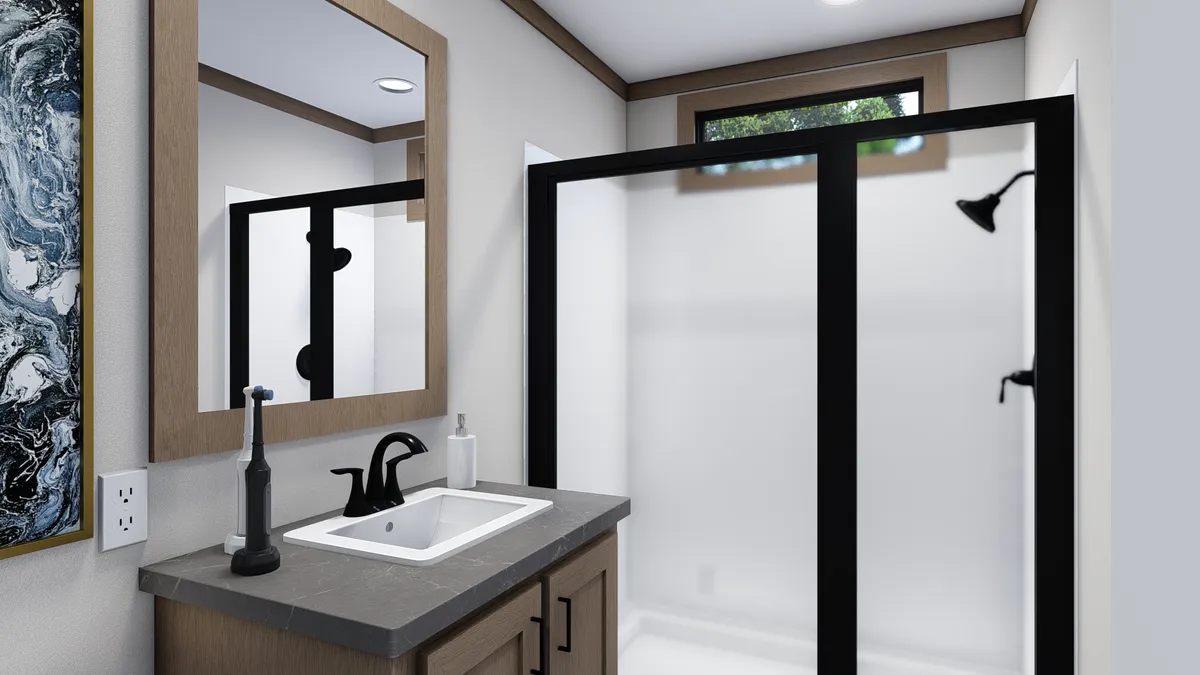 The TRINITY 60 Primary Bathroom. This Manufactured Mobile Home features 2 bedrooms and 2 baths.
