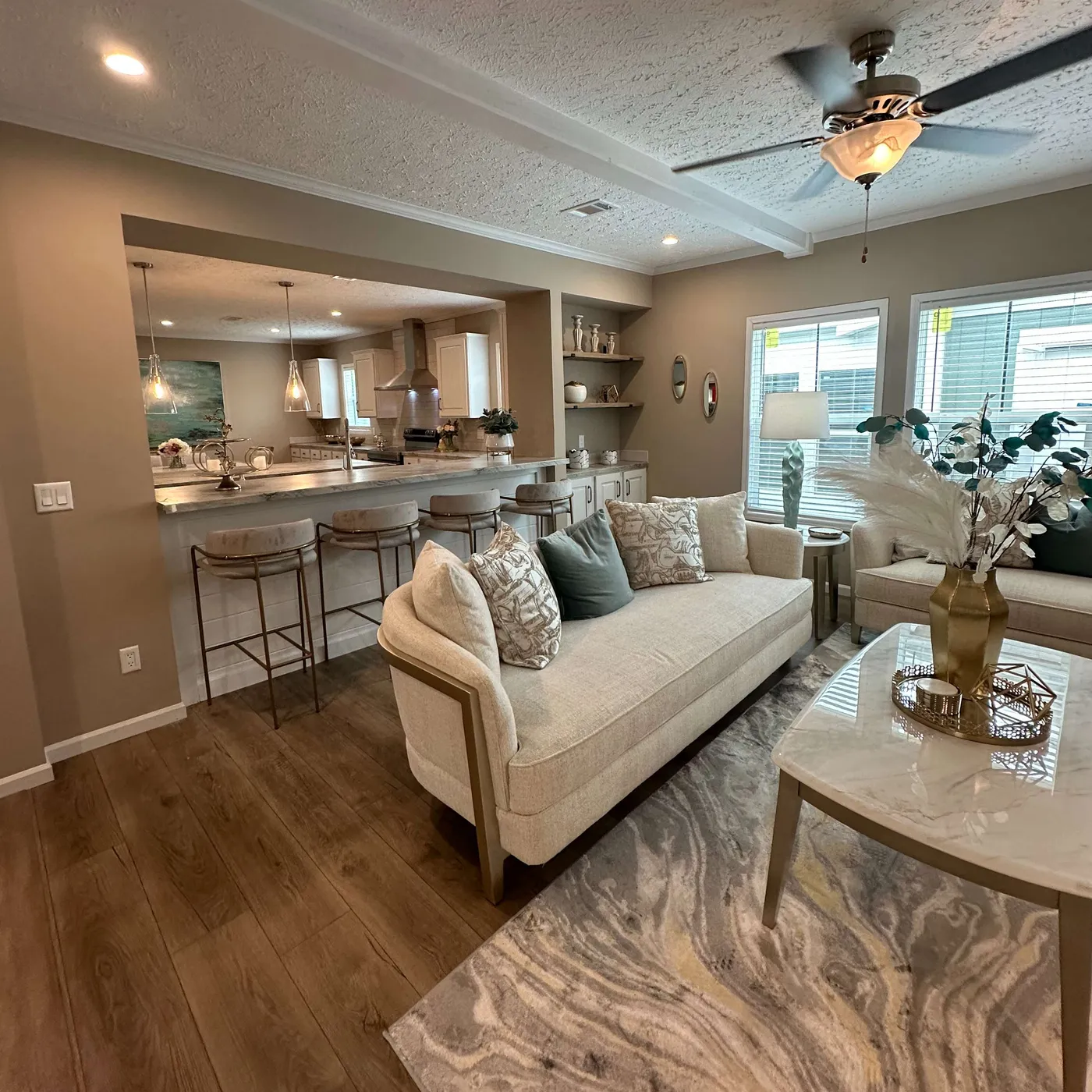 The THE HEXAGON Living Room. This Manufactured Mobile Home features 4 bedrooms and 3 baths.
