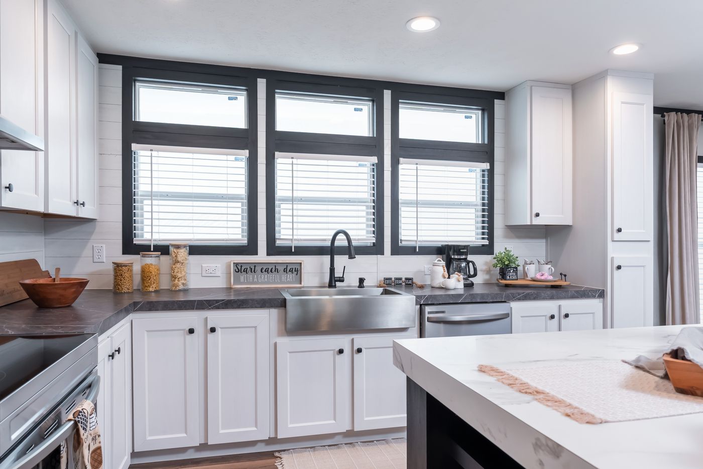 The ABSOLUTE VALUE Kitchen. This Manufactured Mobile Home features 4 bedrooms and 2 baths.