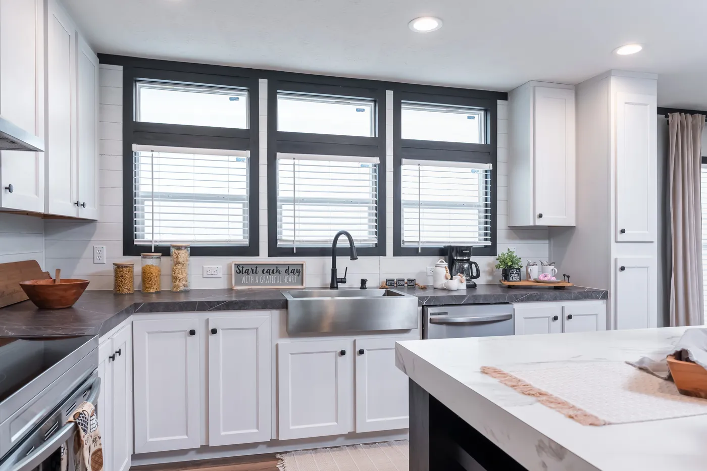 The ABSOLUTE VALUE Kitchen. This Manufactured Mobile Home features 4 bedrooms and 2 baths.