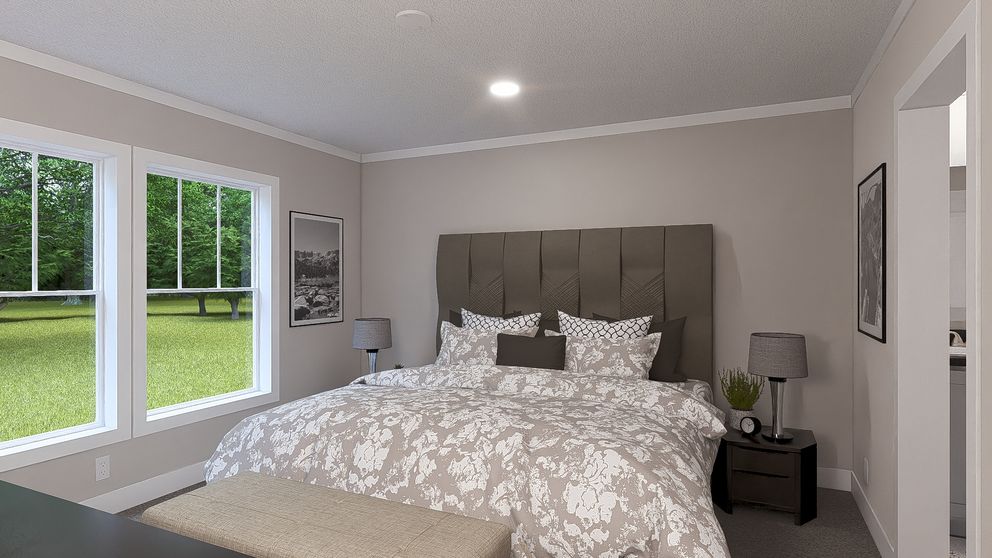 The LEAN ON ME Primary Bedroom. This Manufactured Mobile Home features 3 bedrooms and 2 baths.