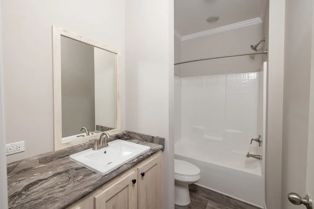 The THE ROGUE Guest Bathroom. This Manufactured Mobile Home features 3 bedrooms and 2 baths.