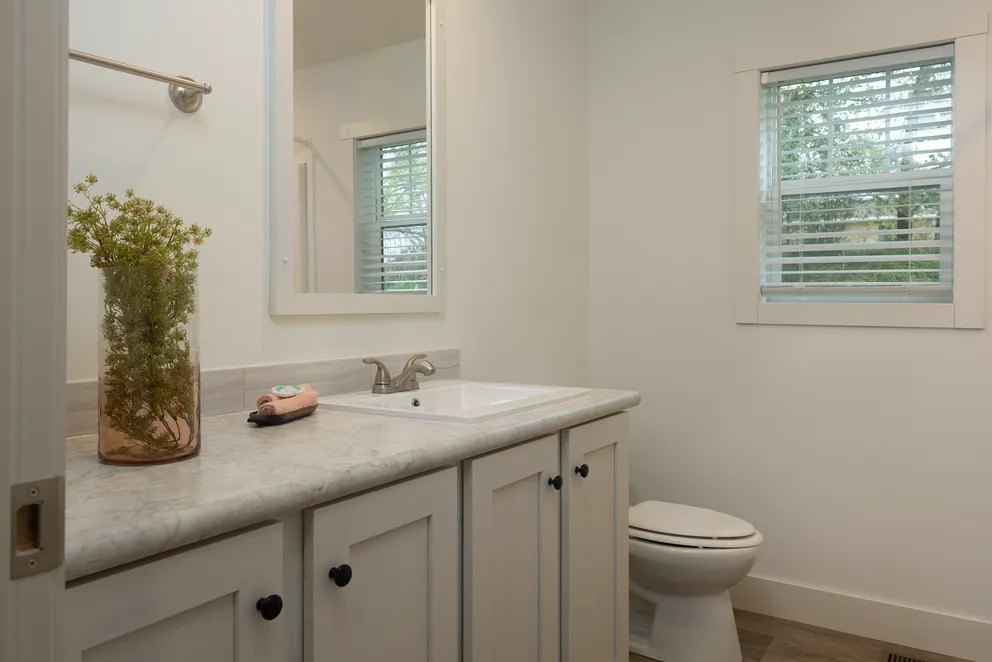 The HEY JUDE Guest Bathroom. This Manufactured Mobile Home features 4 bedrooms and 2 baths.