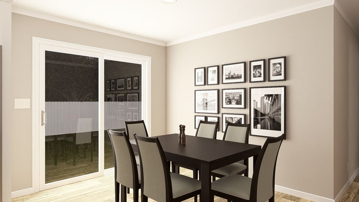 The THE BIG EASY Dining Area. This Manufactured Mobile Home features 4 bedrooms and 3 baths.