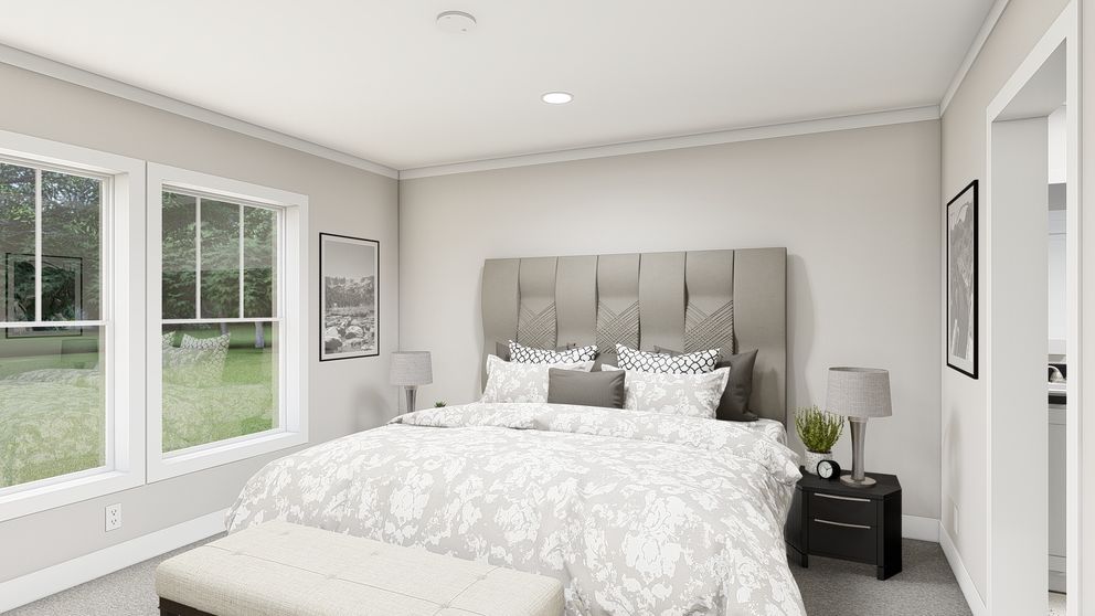 The LEAN ON ME Primary Bedroom. This Manufactured Mobile Home features 3 bedrooms and 2 baths.