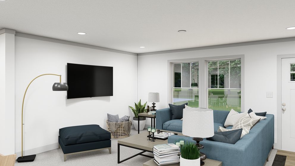 The WONDERFUL WORLD Living Room. This Manufactured Mobile Home features 3 bedrooms and 2 baths.