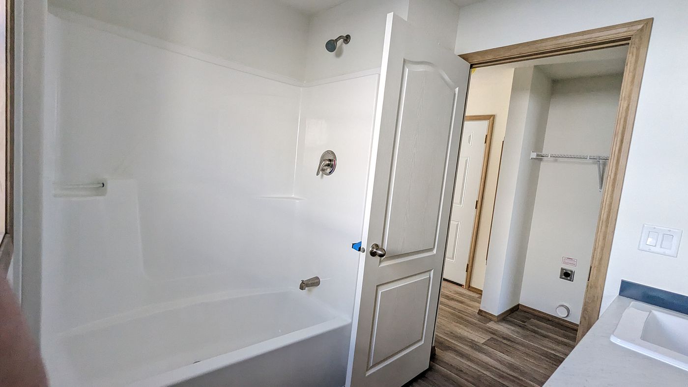 The RAMSEY 215-1 Primary Bathroom. This Manufactured Mobile Home features 1 bedroom and 1 bath.