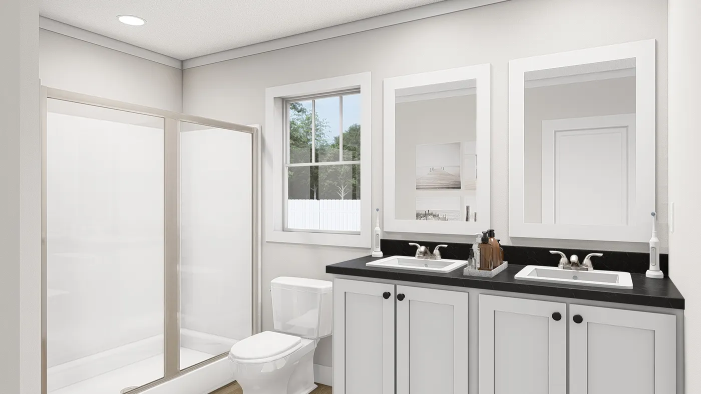 The WHOLE LOTTA LOVE Primary Bathroom. This Manufactured Mobile Home features 3 bedrooms and 2 baths.