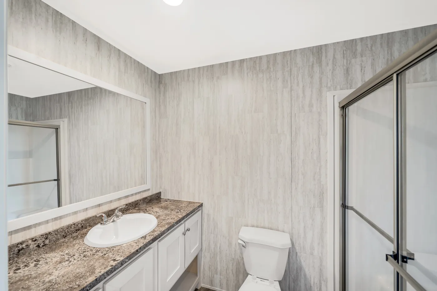 The RUBY Primary Bathroom. This Manufactured Mobile Home features 2 bedrooms and 2 baths.