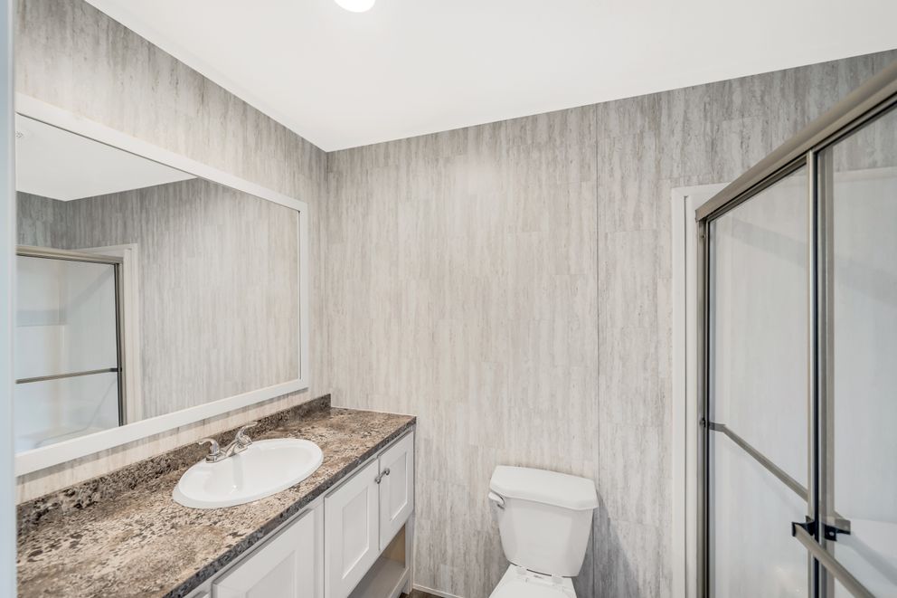 The RUBY Primary Bathroom. This Manufactured Mobile Home features 2 bedrooms and 2 baths.