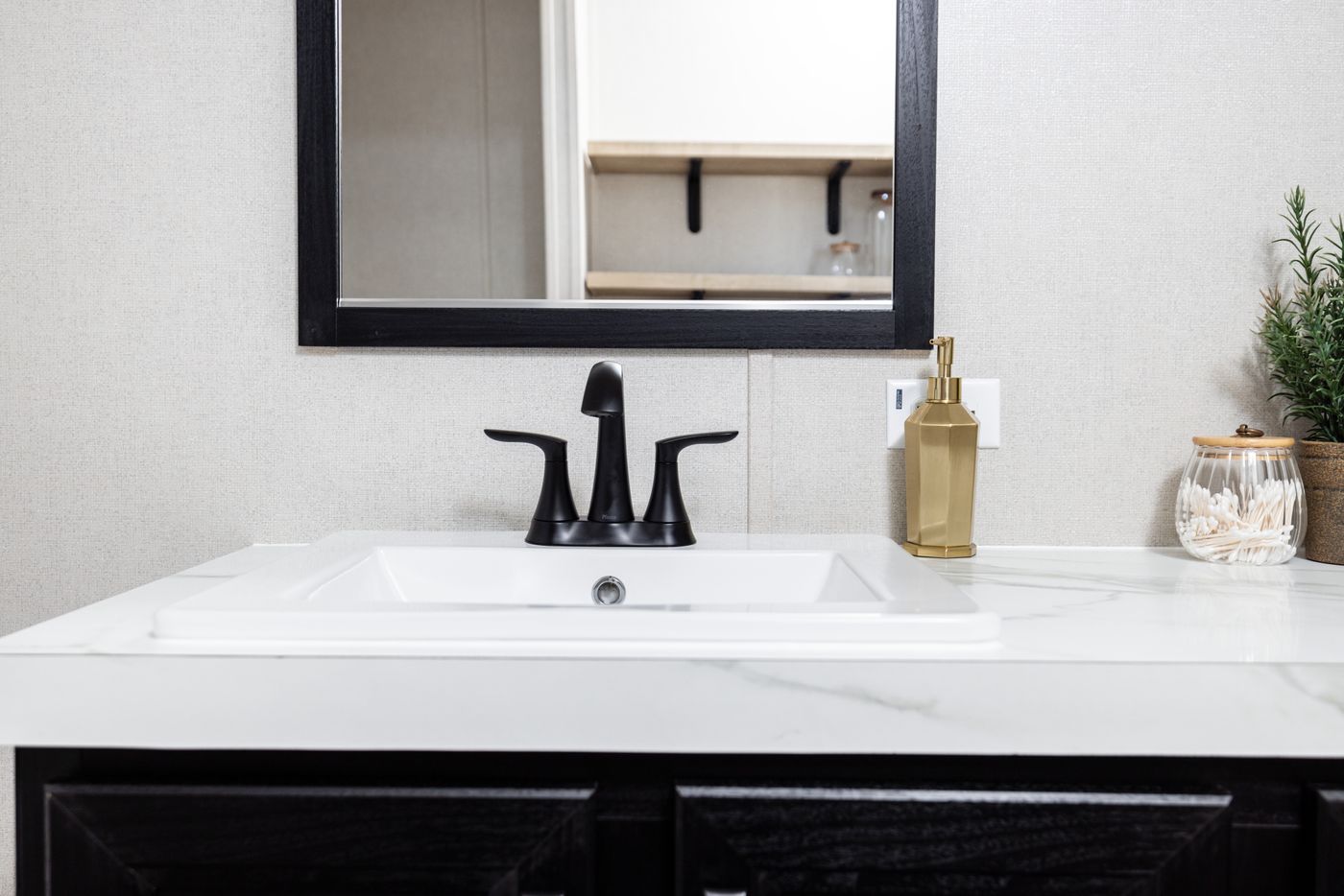 The STERLING ANNIVERSARY Guest Bathroom. This Manufactured Mobile Home features 3 bedrooms and 2 baths.